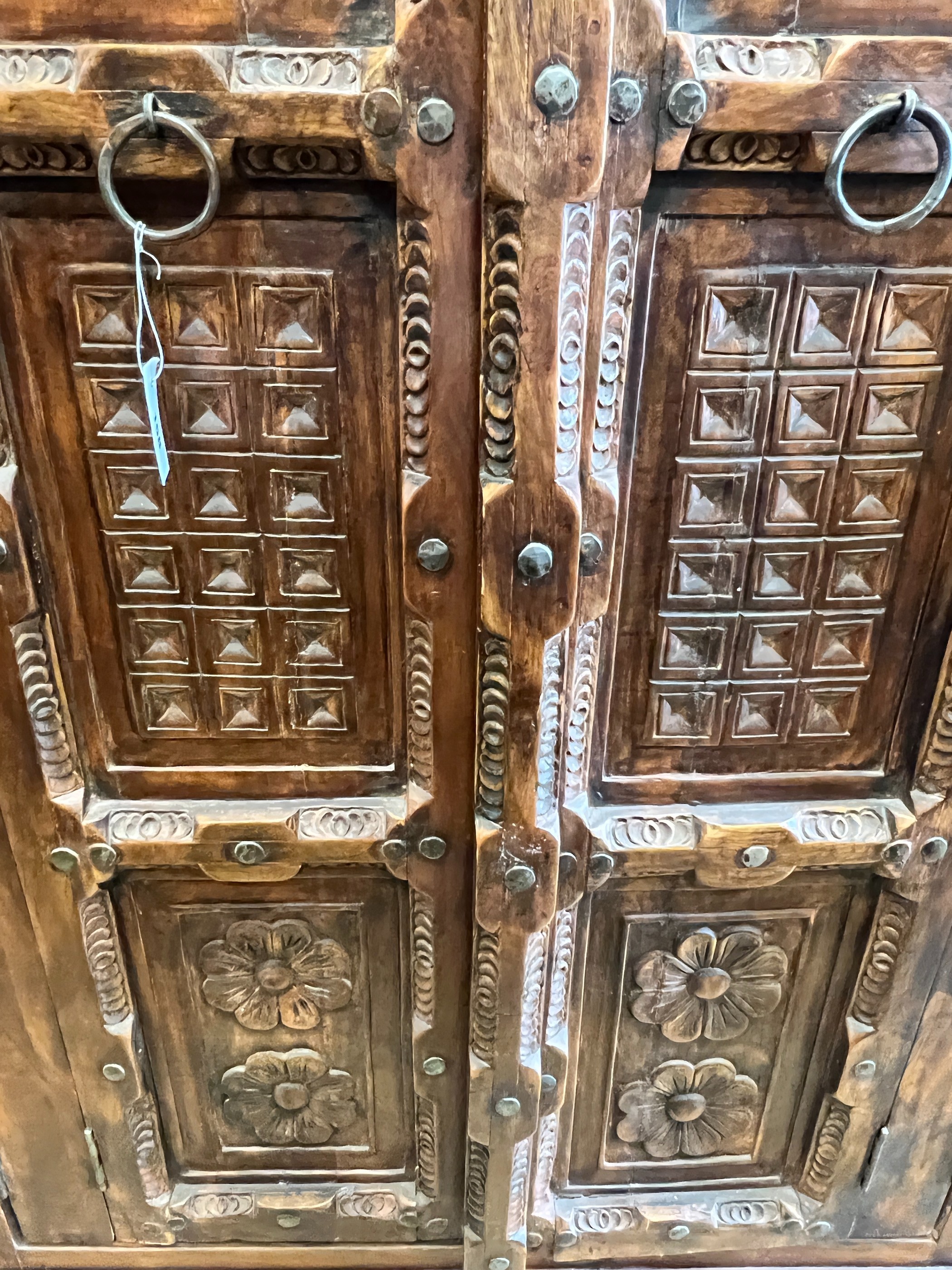 An Eastern carved hardwood two door cabinet, width 119cm, depth 67cm, height 192cm